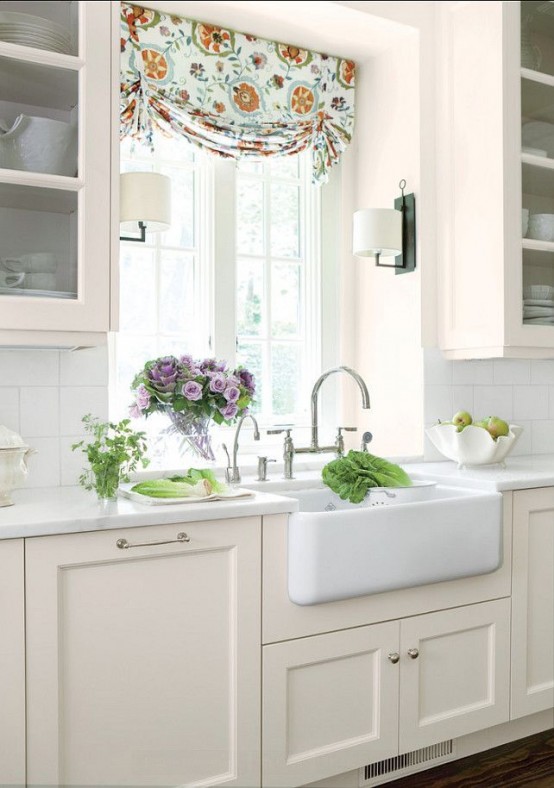 The idea of surrounding things you want to highlight with two wall-mount light fixtures works well with farmhouse sinks.
