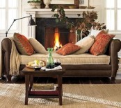 bright rust-colored printed pillows add a fall feel to the space making it cooler