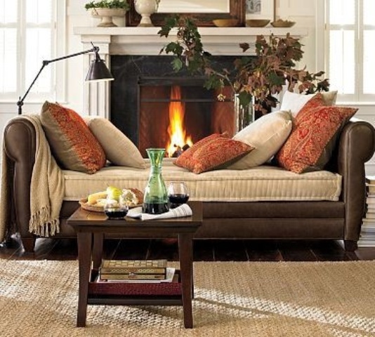 bright rust-colored printed pillows add a fall feel to the space making it cooler