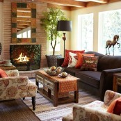 bright printed pillows, a printed rug, a bright framed mirror are cool for adding a fall feel to the space