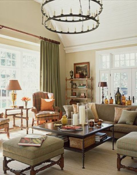 Olive green upholstery and textiles make up a relaxing and welcoming fall colored space