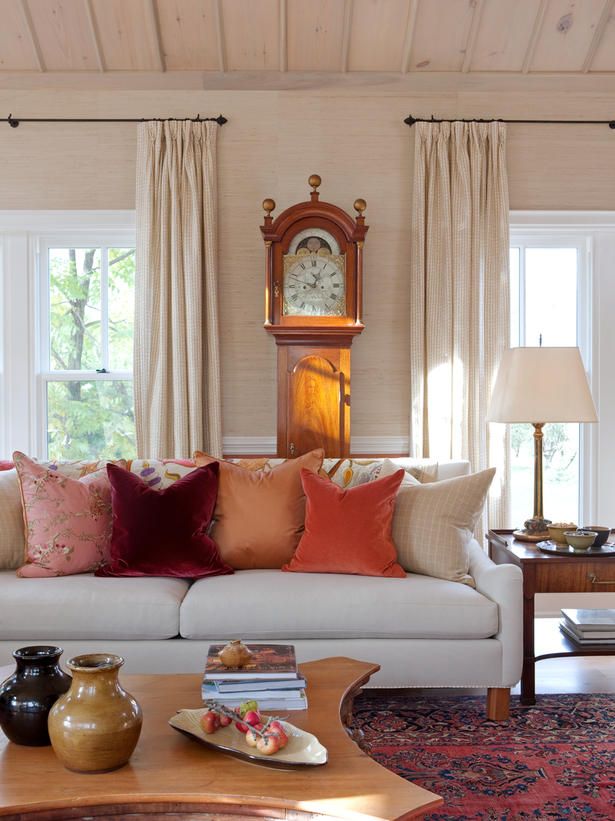 Bright fall colored pillows are enough to bring a fall feel to the living room