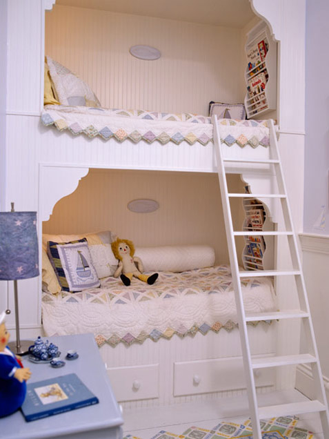 Cozy bedroom for two kids with a built-in bunk bed and a ladder.