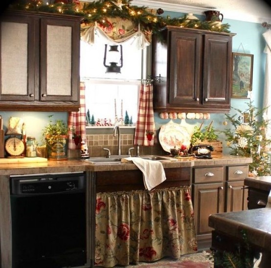 an evergreen and light garland, a Christmas tree, evergreen arrangements and plaid curtains for a holiday feel