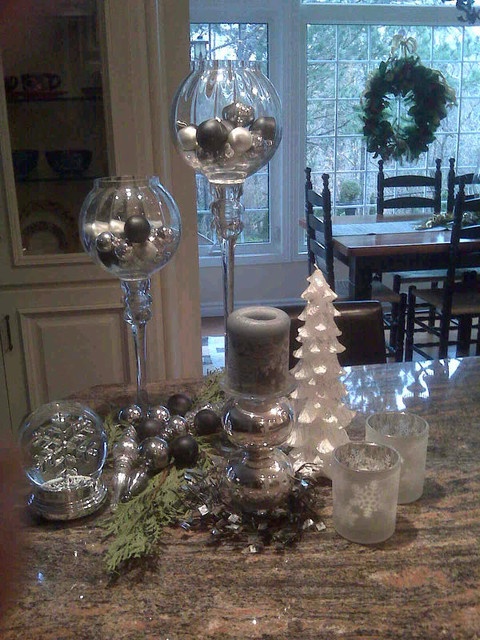 silver and white Christmas decorations, candles, a mini tree and candles for a cool holiday feel in the space