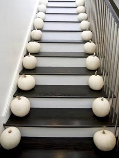 Here is a great idea for a lazy decorator! Put pumpkins on both sides of all steps. You will need a lot of them but how hard can it be to create such display, right?