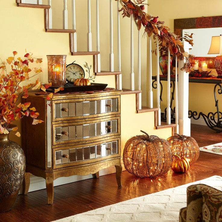It's a great idea to add something glowing to your stairs decor. In this  case faux twig pumpkins would help to create relaxed ambiance before the Thanksgiving dinner.