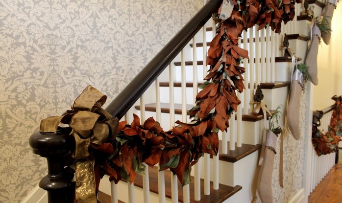 DIY garland of fallen leaves won't hurt your budget but would look great on staircase.