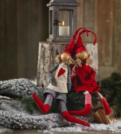 Christmas elves dressed up in grey and red with hearts and tall hats are great for holiday decorating