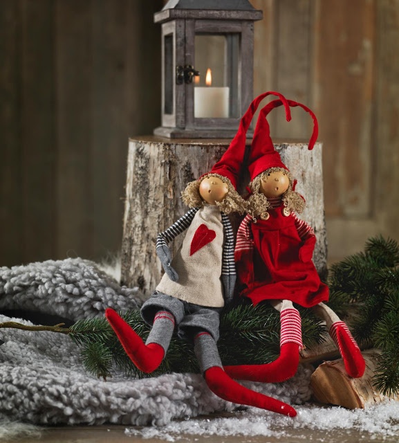 Christmas elves dressed up in grey and red with hearts and tall hats are great for holiday decorating