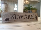 a rustic wooden Halloween sign is a nice decoration and a cool DIY is a great addition to your Halloween decor