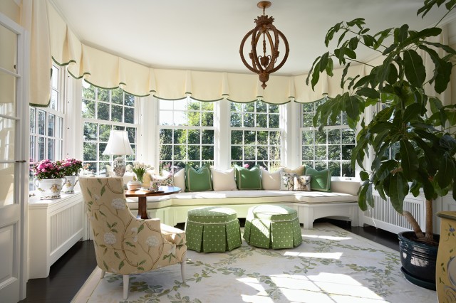 Cozy Sunroom With A Bunch Of Planters