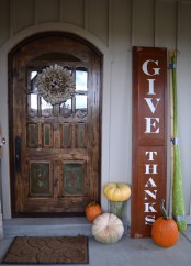 a Thanksgiving sign and some natural pumpkins make the porch inviting and won’t take much time to decorate