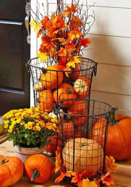 Cylindrical wire baskets is a great outdoor alternative to similar glass vases. You can stuff them with pumpkins, gourds, leaves and any other autumn's things.