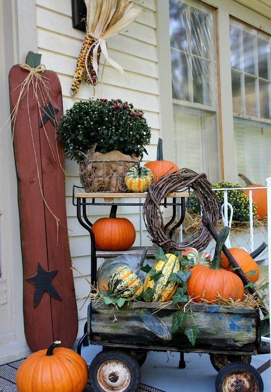 A vintage rolling cart is a perfect base for your fall arrangement.  It usually looks quite rustic and cozy. Besides, you can move such arrangement whatever you like.