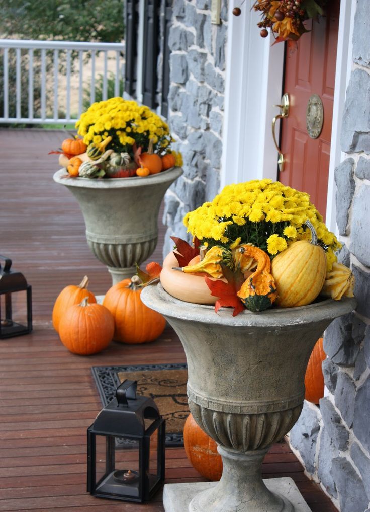 Besides traditional fall blooms you can put small pumpkins and gourds, faux leaves and other products of harvest there. Pumpkins in various colors and sizes make a beautiful fall decoration when piled in a planter and placed on your porch. Use a block of florist's foam to keep all these stuff at the top when your planters are too big.