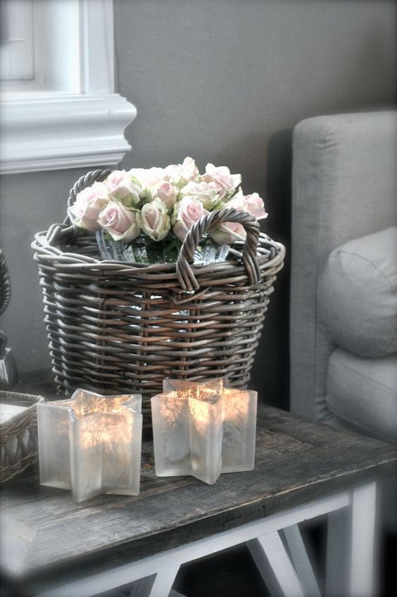 Star shaped candle holders, a baskets with blooms for decorating the space in farmhouse style