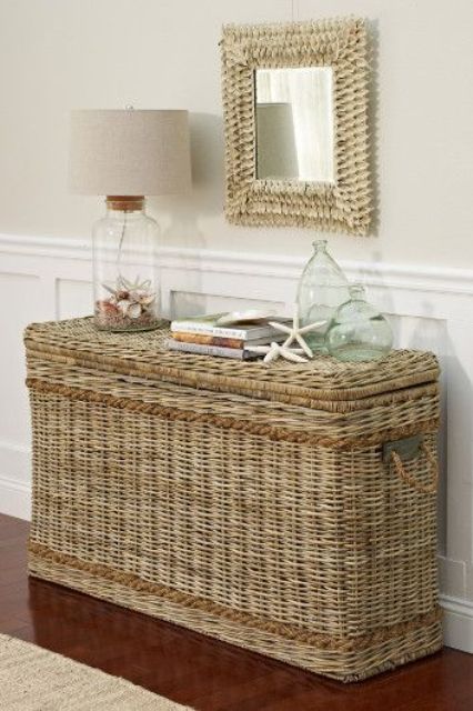 a tall and sleek wicker chest will be a nice idea for storage and an alternative to a console table in your entryway, it's great for a beach or coastal space