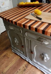 a catchy colorful striped butcherblock counertop make the vintage kitchen island very cool and very interesting