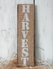 a burlap fall sign with white letters is a pretty rustic option using non-traditional materials