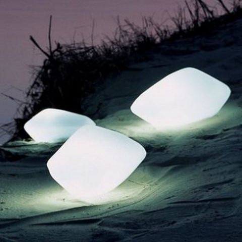 catchily shaped outdoor lamps like these ones can be placed anywhere - on the ground, floor, furniture and next to you on the table