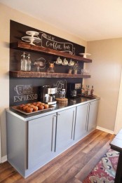 a coffee bar styled with a chalkboard wall for making notes and with rough wooden shelves looks very chic and very cozy
