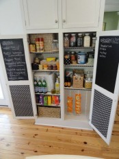 a cool pantry made functional with chalkboard doors