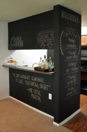 a chalkboard kitchen island with an additional wall and light is a cool idea for a modern kitchen and can be integrated into many decor styles