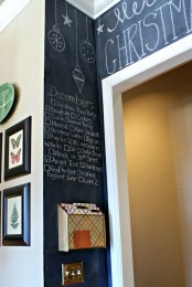 a statement chalkboard wall over the doorway is a lovely practical idea to make notes easily and it’s an awkward nook used
