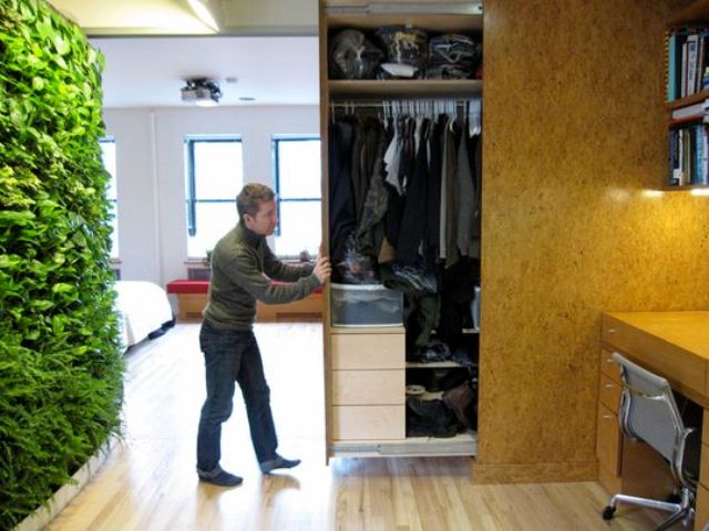 A whole closet hidden in the wall and retracted when needed is a cool idea for small homes   you won't need a separate room
