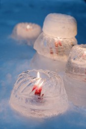 pretty and cute ice luminaries made using pudding molds are a cool and sweet idea, they won’t be large but the shape will be cooler