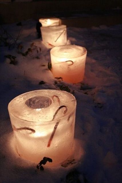 Ice glass shaped luminaries with candy canes inside will instantly make your garden look like Christmas and will add a festive feel to it