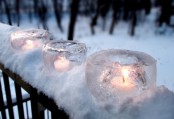 glass-shaped ice candleholders are easy to make yourself and they can placed anywhere you like to add a amgical touch to the space