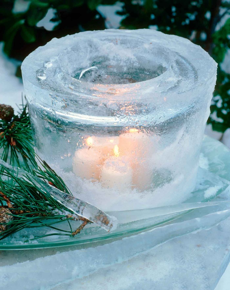 A large glass shaped ice luminarie with several candles looks more spectacular and bright than a usual one