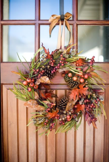 a bright fall wreath of grasses, bold leaves, pinecones, berries, acorns and other elements to style your front door