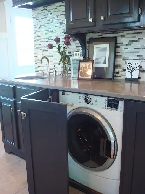 The best place for a washing machine on a kitchen is near a sink. It's easier to connect it to water there.