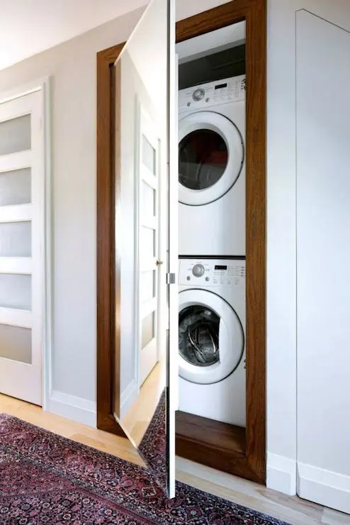A narrow walk-in closet could fit both a washing machine and a dryer stacked on each other.