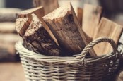 a basket with firewood is a lovely idea for any space, it will add coziness and a rustic feel to the room