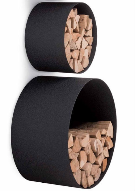 black metal round storage units can be attached to the wall and used not only for firewood storage but also for other stuff, too