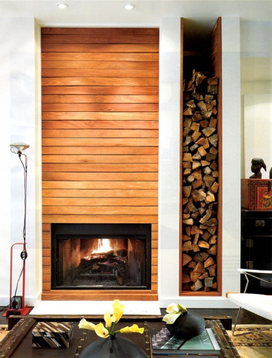 a built-in fireplace and a niche for firewood next to it add warmth and coziness to the space