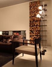a minimalist tiered open firewood storage attached to the wall is a stylish feature that brings coziness in here