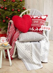 knit red, white and grey pillows with traditional Christmas prints are perfect for styling your space for Christmas if you love traditional color schemes