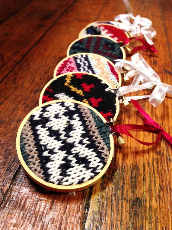 An assortment of colorful knit Christmas ornaments made using embroidery hoops   you may knit them or upcycle your old sweaters