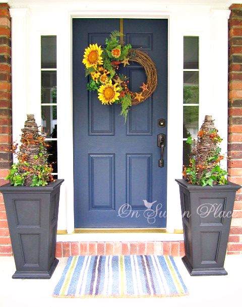 A DIY twig wreath with some faux sunflowers would add a splash of color to your door.