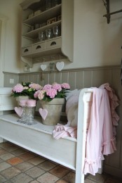 a shabby chic entryway done in neutrals, a shelving unit, a wooden bench, a tiled floor