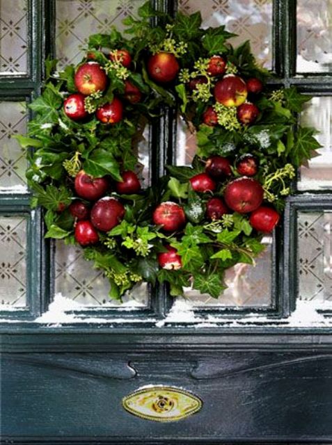 a cool fall wreath of faux greenery and apples is simple and very bright and will make you feel like fall at once