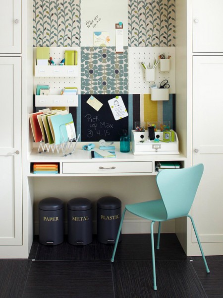 Cute built-in working desk surrounded by storage units.