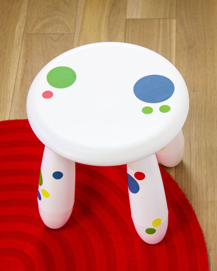 A white IKEA Mammut stool with colorful polka dots is a bold and cool idea   add removable stickers to make it bolder