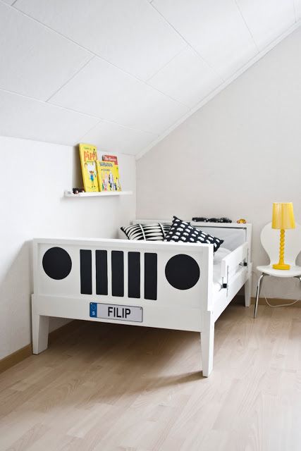 a neutral kid's room with a white Sundvik bed turned into a little car and yellow touches for a bold look
