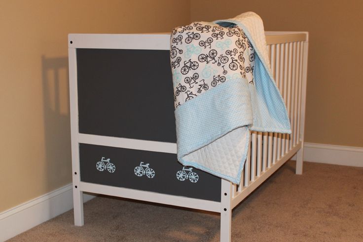 A white IKEA Sundvik crib with a chalkboard side is a cool idea for any nursery and it inspires the kid to be creative
